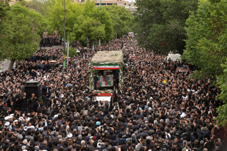 People attend a funeral ceremony for the late Iranian President Ebrahim Raisi in Tabriz